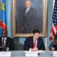 Delegates from Rwanda and DR Congo shake hands in Washington after signing a U.S.-brokered peace agreement.