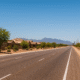 Buckeye’s sunlit roads and desert backdrops shimmer under intense heat — residents beat the blaze with hydration, shade, and smart timing.