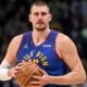 Nikola Jokic celebrating a Nuggets win — the MVP’s quiet dominance underpins an $80 M fortune.