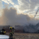 Thick black smoke rises above Burns, Wyoming, as emergency responders battle a large fire forcing urgent evacuations.