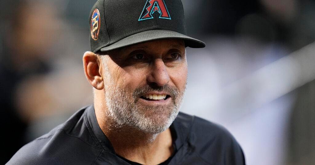 Torey Lovullo leading the Diamondbacks dugout—earning $5 million a year and turning Arizona into a contender.