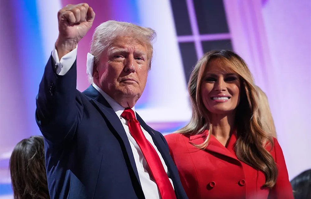 Melania Trump stands stoically beside President Trump — her distant gaze fueling endless speculation about her quiet power.