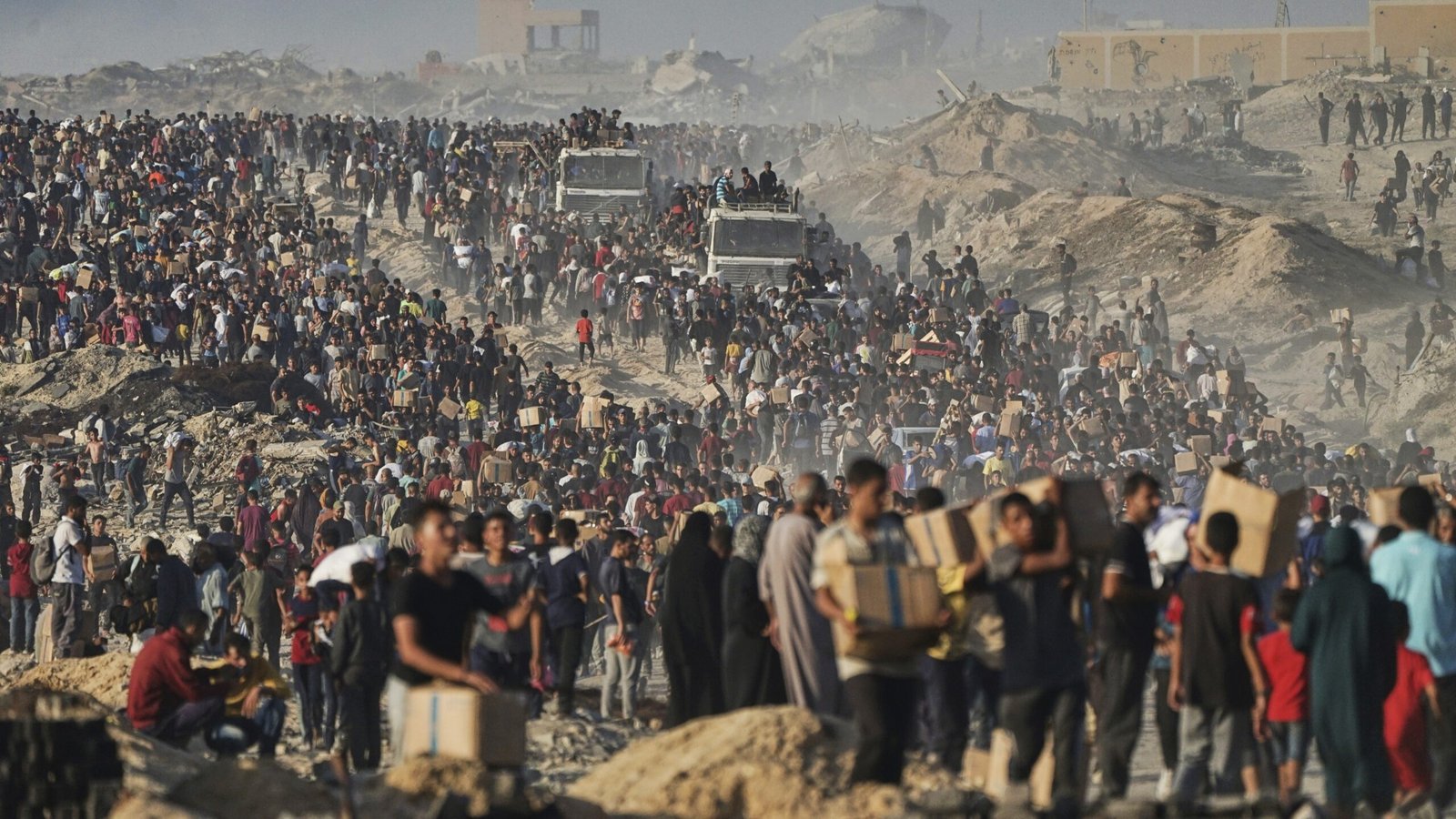 A child walks past a GHF food site in southern Gaza, hours after Israeli gunfire reportedly killed 19 civilians seeking aid.