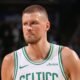 Kristaps Porziņģis in Celtics green — now heading to Atlanta in a dramatic three-team NBA trade.