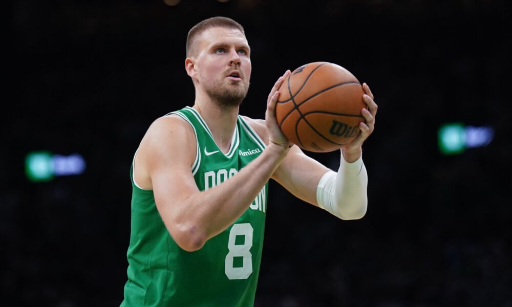 Kristaps Porziņģis celebrates after a game-winning shot — the Celtics' center continues to make headlines both on and off the court