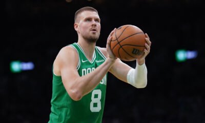 Kristaps Porziņģis celebrates after a game-winning shot — the Celtics' center continues to make headlines both on and off the court