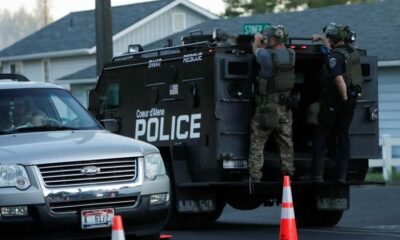 SWAT teams and emergency responders gather at Canfield Mountain in Idaho after two firefighters were killed in a sniper ambush amid a wildfire.