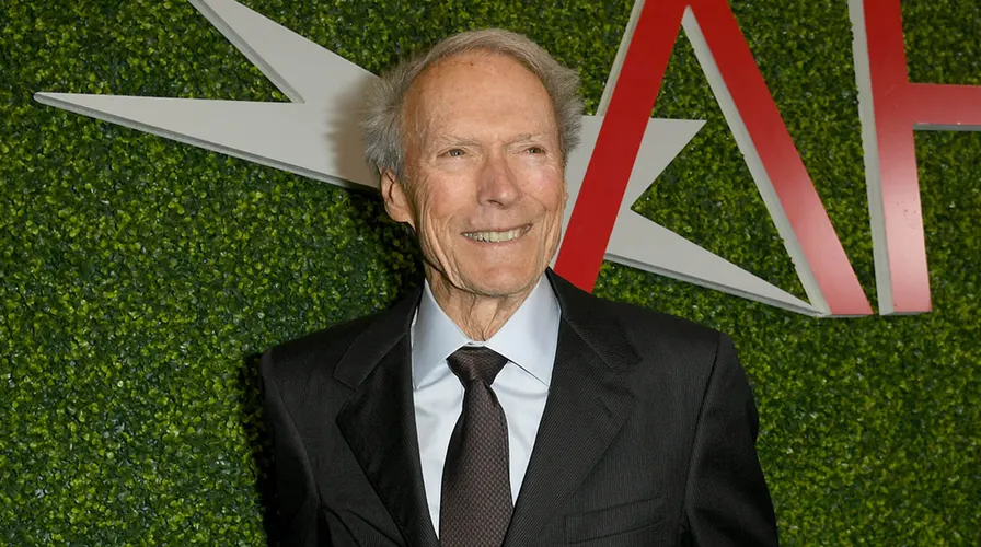 Clint Eastwood on set—iconic actor, director, and producer whose seven-decade career has amassed a reported $375 million fortune.