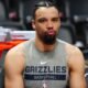 Dillon Brooks locking eyes with an opponent—his grit on the court fuels an $86 million deal and multi‑million net worth.