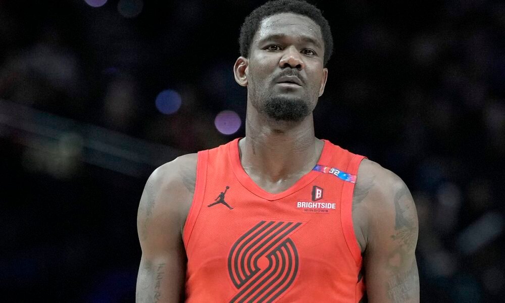 Deandre Ayton walks off the court during a Trail Blazers game—now a free agent, he eyes a new opportunity with a winning franchise.