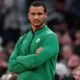 Joe Mazzulla strategizing during a Celtics game — leading Boston to their 18th NBA championship in 2024.