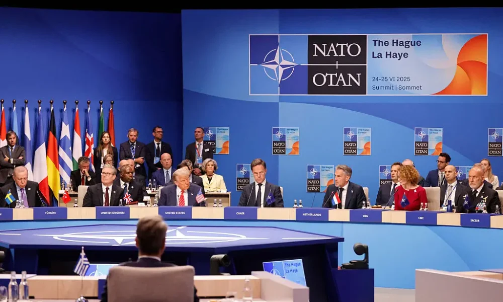 NATO leaders gather for a high-stakes summit on defense spending as China issues strong warnings against “escalatory militarism.”