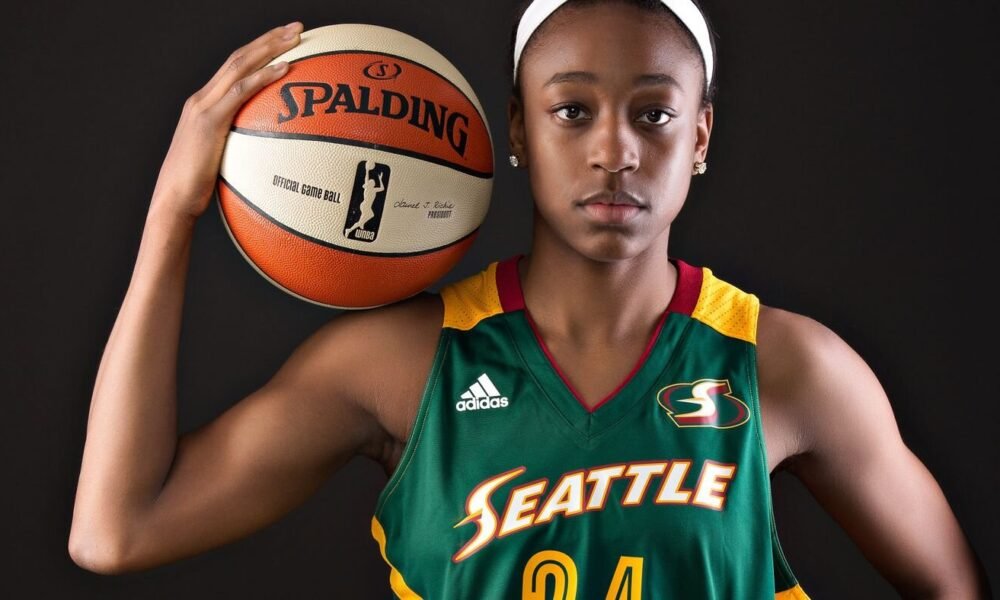 Jewell Loyd in her new Aces jersey—her 2025 move to Las Vegas marks a fresh chapter in her rising financial journey.