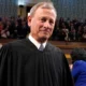 Chief Justice John Roberts delivers a rare public address amid escalating tensions over Supreme Court rulings.