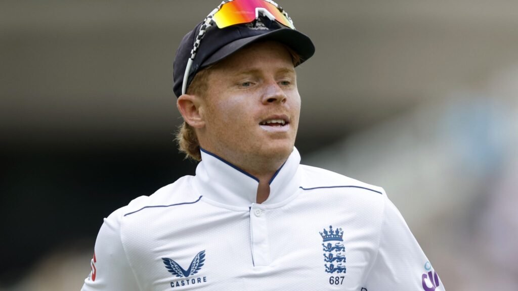 Ollie Pope celebrating a classy century — a moment of pure elegance on field and in his financial stride.

