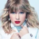Taylor Swift performing during The Eras Tour, the record-breaking tour that helped propel her into billionaire status.