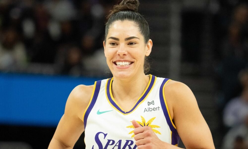 Kelsey Plum coaching at a Dawg Class clinic, guiding the next generation of elite guards in 2025.