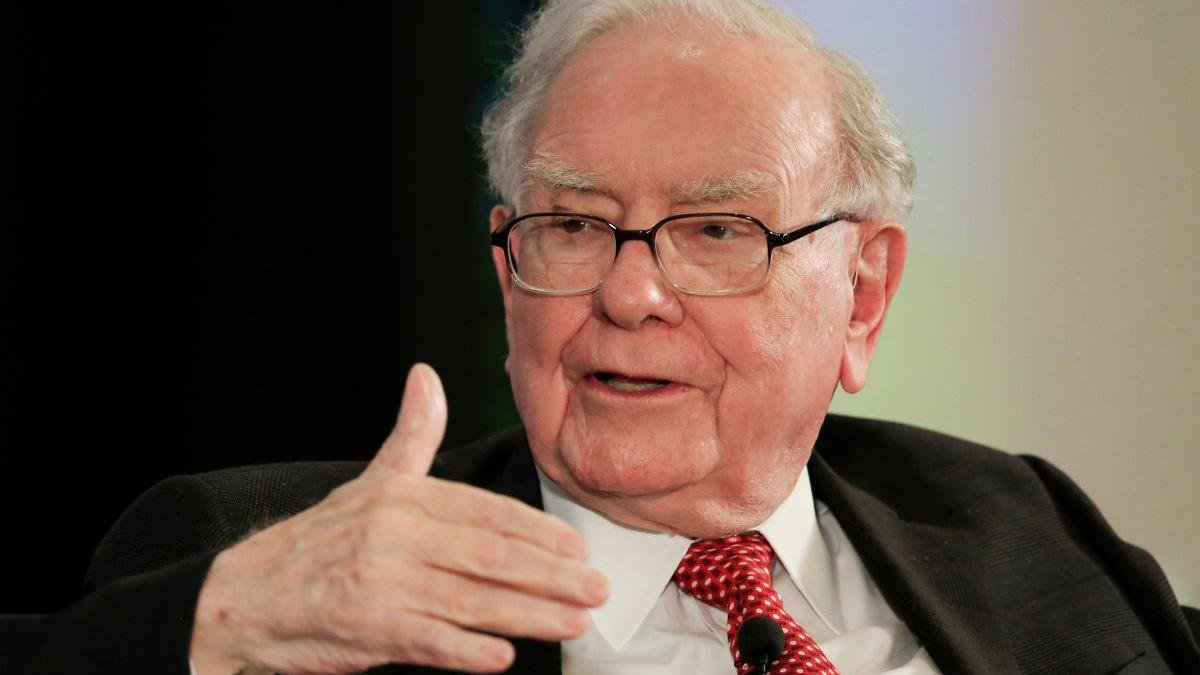Warren Buffett at a Berkshire Hathaway annual meeting — the legendary investor has now donated over $56 billion to charity.