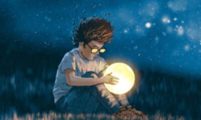 boy with a little moon in his hands