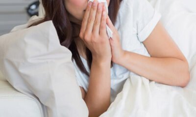 woman_lying_down_blowing_nose