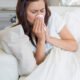 woman_lying_down_blowing_nose