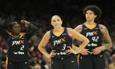 Basketball players in team uniforms.