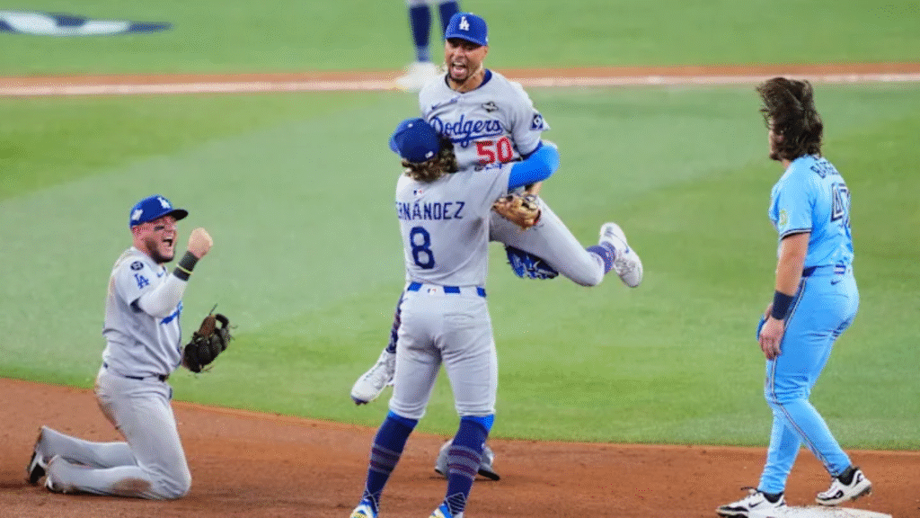 Kiké Hernández celebrates after his game-saving double play seals the Dodgers’ 3–1 win over the Blue Jays, forcing a Game 7 in the World Series.