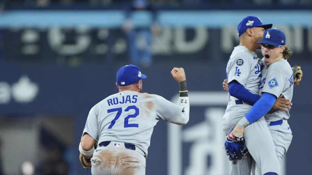 Kiké Hernández celebrates after his game-saving double play seals the Dodgers’ 3–1 win over the Blue Jays, forcing a Game 7 in the World Series.