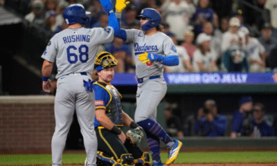 Kiké Hernández celebrates after his game-saving double play seals the Dodgers’ 3–1 win over the Blue Jays, forcing a Game 7 in the World Series.