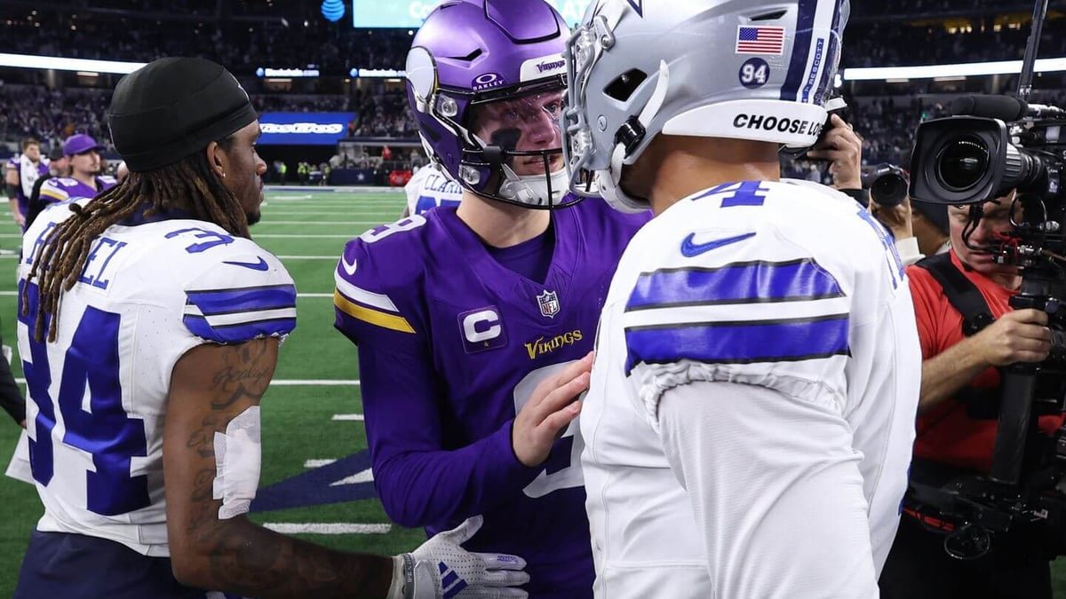 Vikings quarterback JJ McCarthy celebrates after throwing one of his two touchdown passes against the Cowboys