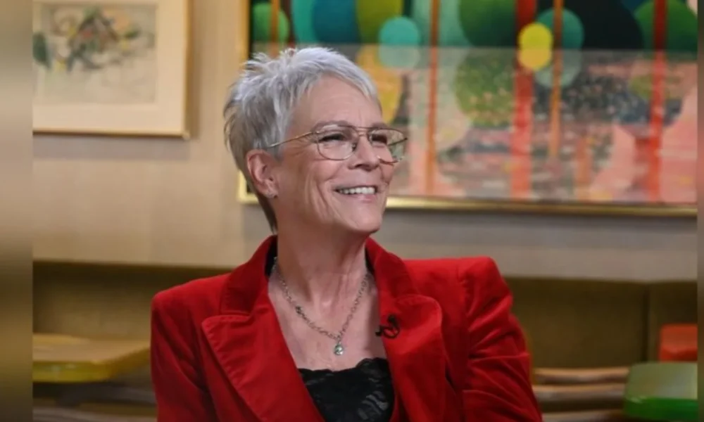 Person in red jacket, abstract background.