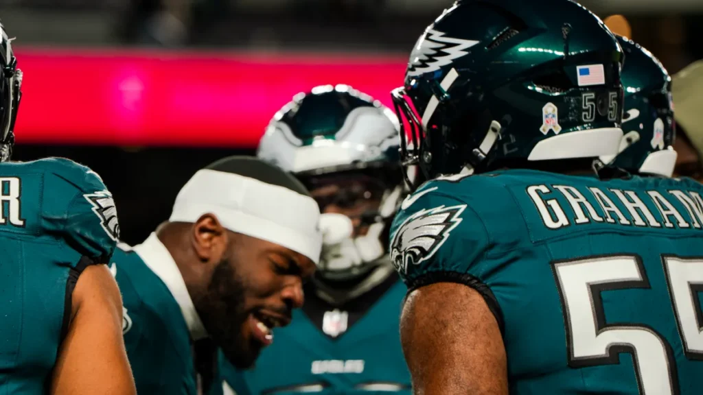 Eagles defenders celebrate after completing a historic 31–0 shutout of the Raiders