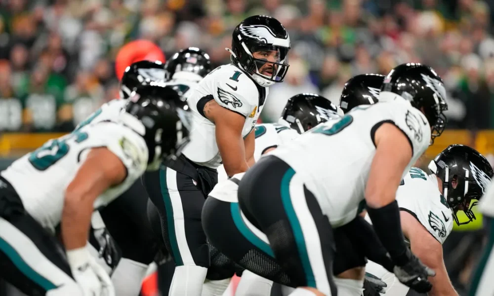 Eagles defenders celebrate after completing a historic 31–0 shutout of the Raiders