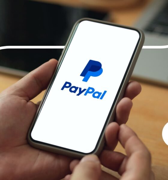 PayPal logo on phone and laptop.