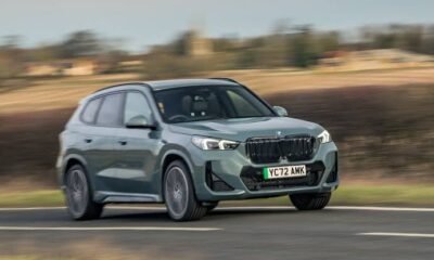 BMW SUV driving on a road