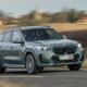 BMW SUV driving on a road